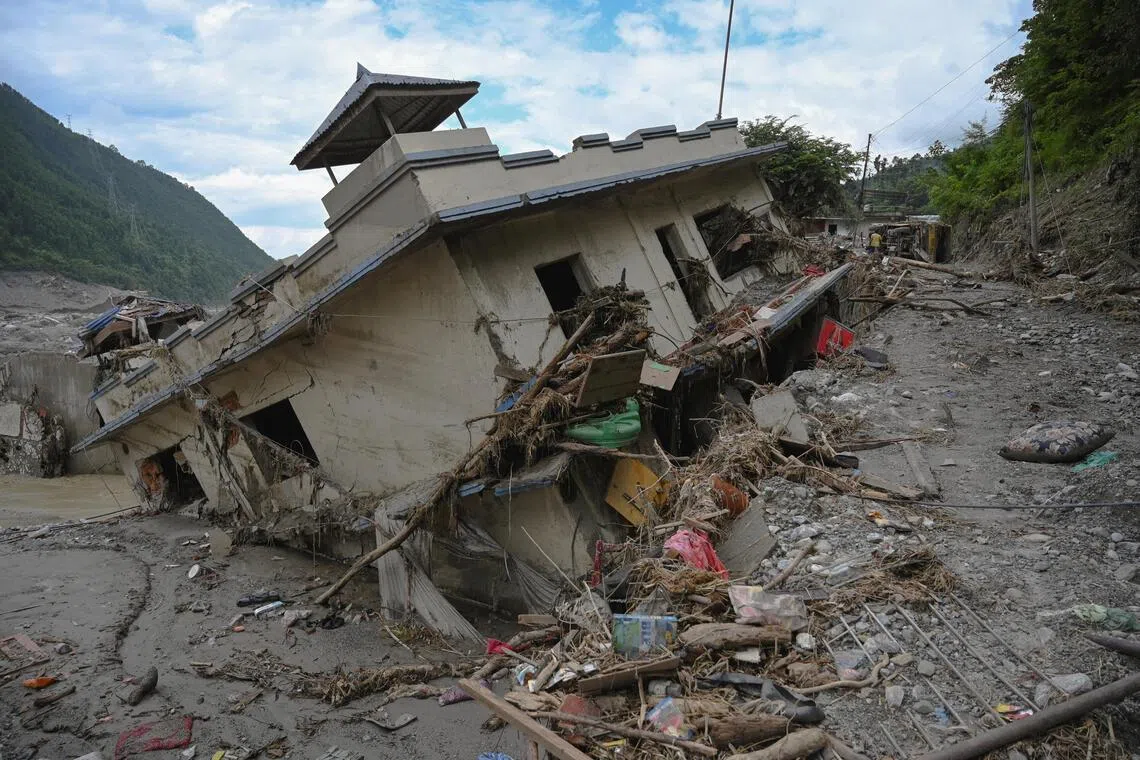 Damaged buildings near Trishuli River following deadly flash floods, in Betrawati Bazaar in Rasuwa district, Nepal, on Aug 30.