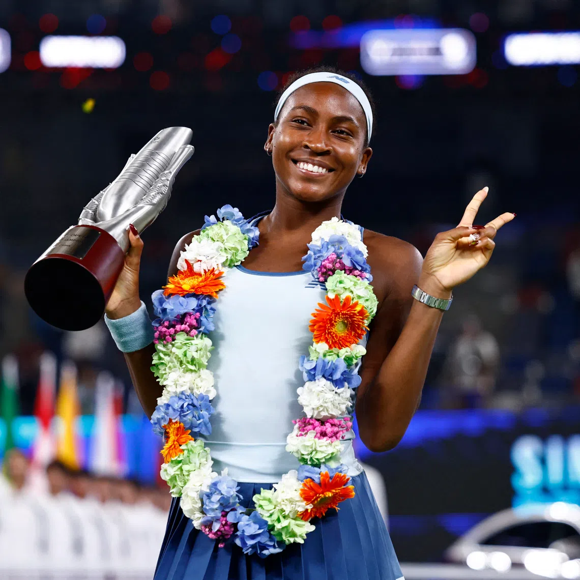 Tennis - WTA 1000 - Wuhan Open - Optics Valley International Tennis Center, Wuhan, China - October 12, 2025 Coco Gauff of the U.S. poses with the trophy after winning the final against Jessica Pegula of the U.S. REUTERS/Tingshu Wang