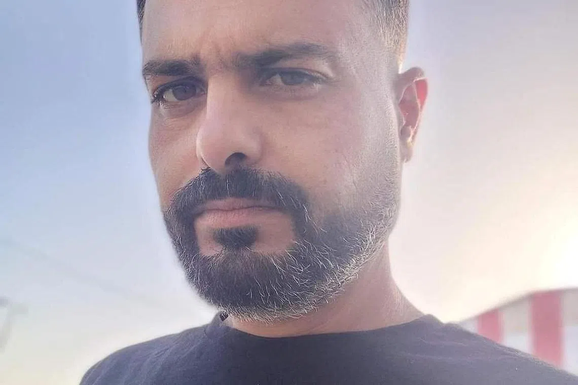 FILE PHOTO: World Central Kitchen (WCK) team member Nadi Sallout, who WCK says was killed in Gaza, appears at an unknown location in this undated handout image. World Central Kitchen/Handout via REUTERS/File Photo