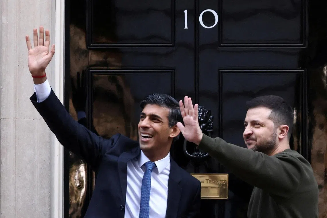 British Prime Minister Rishi Sunak (left) welcomes Ukrainian President Volodymyr Zelensky to London, on Feb 8, 2023.
