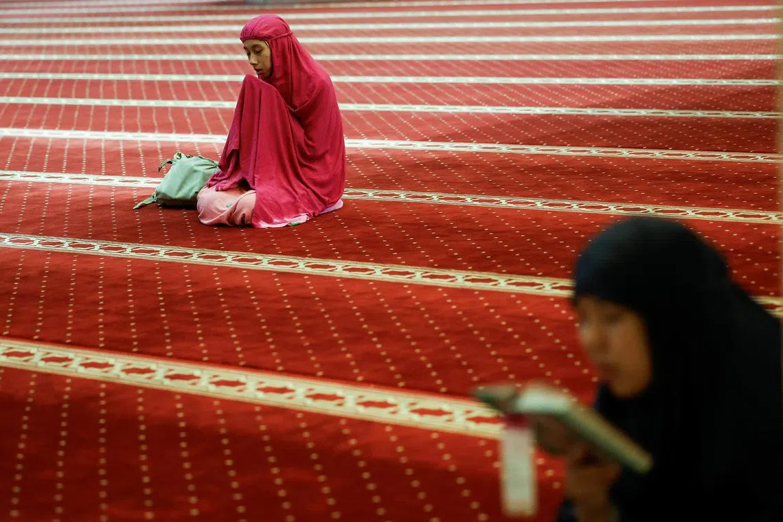 An Indonesian Muslim woman praying at the Grand Mosque of Istiqlal during the holy fasting month of Ramadan in Jakarta, Indonesia, March 14, 2024. 