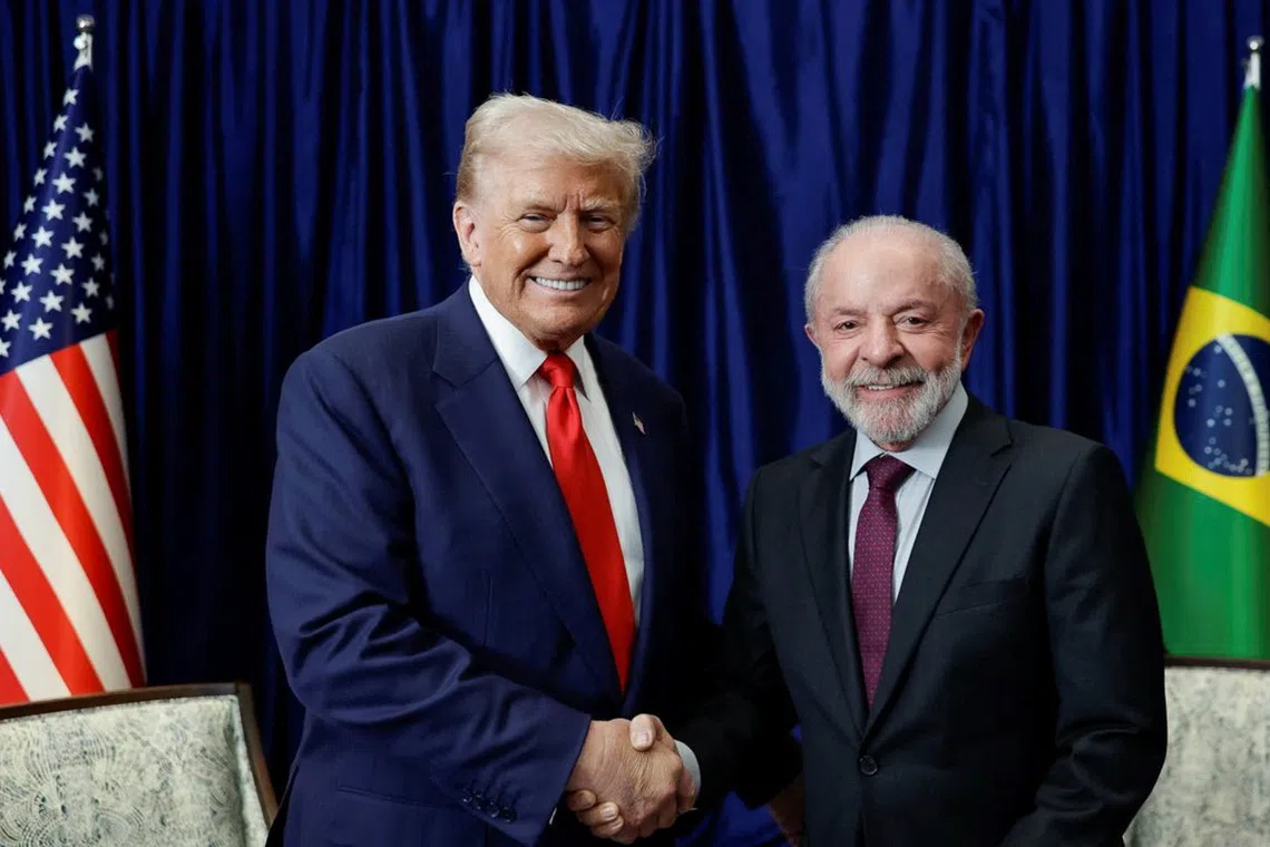 U.S. President Donald Trump and Brazilian President Luiz Inacio Lula da Silva shake hands as they meet on the sidelines of the 47th Association of Southeast Asian Nations (ASEAN) summit in Kuala Lumpur, Malaysia, October 26, 2025. Ricardo Stuckert/Brazil Presidency/Handout via REUTERS ATTENTION EDITORS - THIS IMAGE HAS BEEN SUPPLIED BY A THIRD PARTY. NO RESALES. NO ARCHIVES