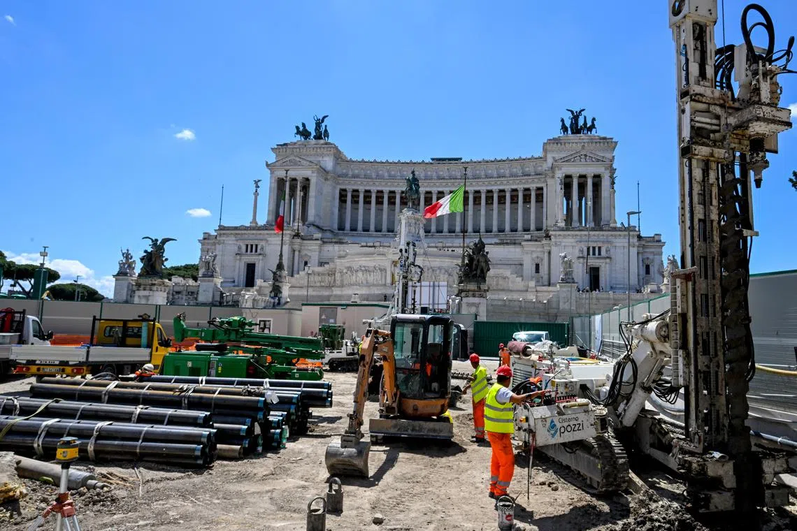 Workers are seen at the subway station construction site near Piazza del Campidoglio (Capitoline Square) in Rome, Italy, May 23, 2024. REUTERS/Alberto Lingria