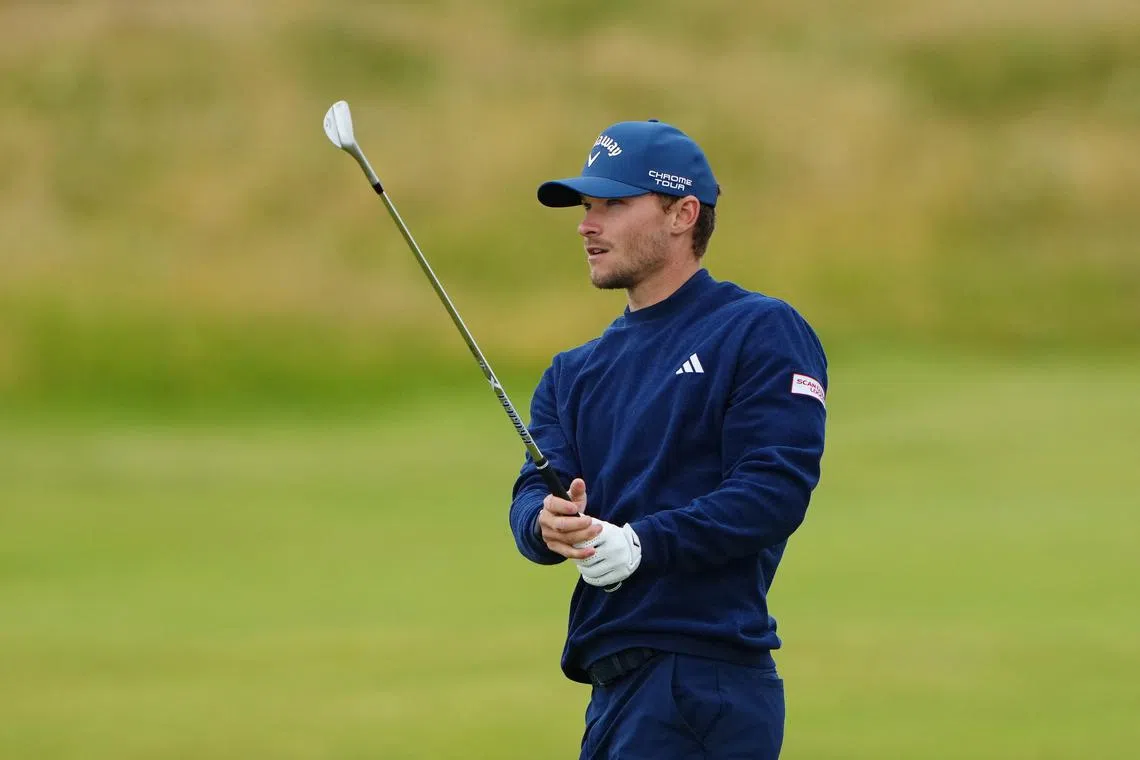 FILE PHOTO: Golf - The 152nd Open Championship - Royal Troon Golf Club, Troon, Scotland, Britain - July 18, 2024 Denmark's Nicolai Hojgaard watches his approach shot on the 4th fairway during the first round REUTERS/Maja Smiejkowska/File Photo