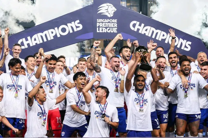 Lion City Sailors captain Hariss Harun lifting the Singapore Premier League title alongside his teammates at Our Tampines Hub on May 17, 2026. 