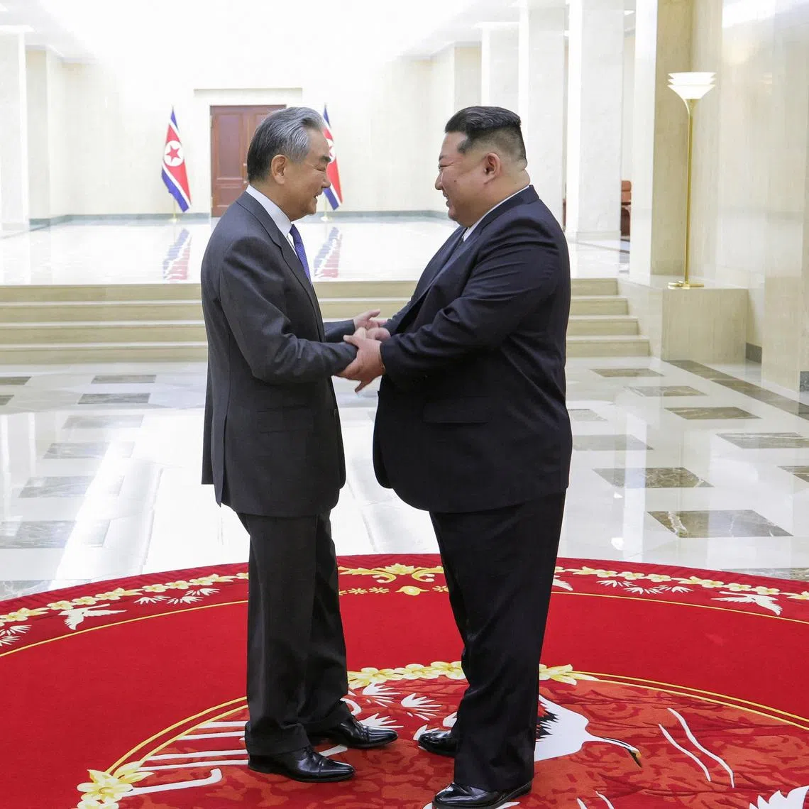 North Korean leader Kim Jong Un shakes hands with China's Foreign Minister Wang Yi as they meet in Pyongyang, North Korea, April 10, 2026, in this picture released by North Korea's official Korean Central News Agency.  KCNA via REUTERS