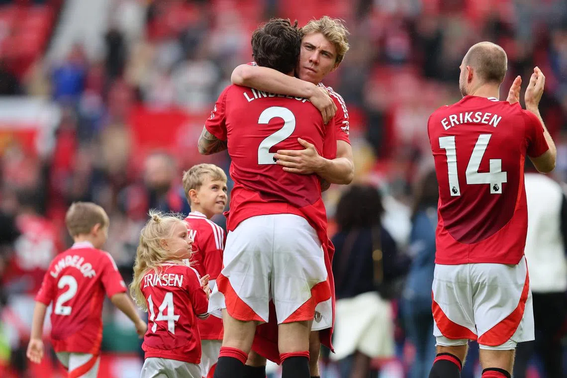 Rasmus Hojlund of Manchester United hugging teammate Victor Lindelof after the English Premier League match between Manchester United and Aston Villa on May 25.