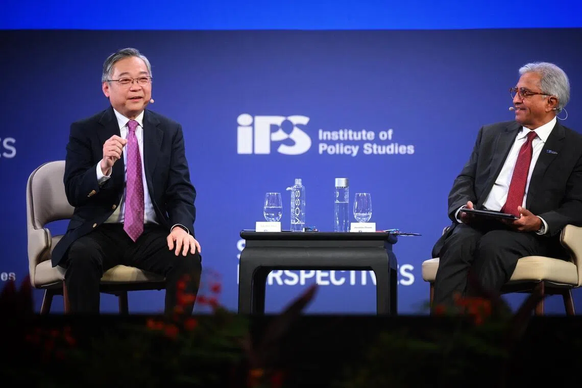 DPM Gan Kim Yong (left) and IPS director Janadas Devan speak during the dialogue at the panel session at the Singapore Perspectives 2026 on Jan 26, 2026.