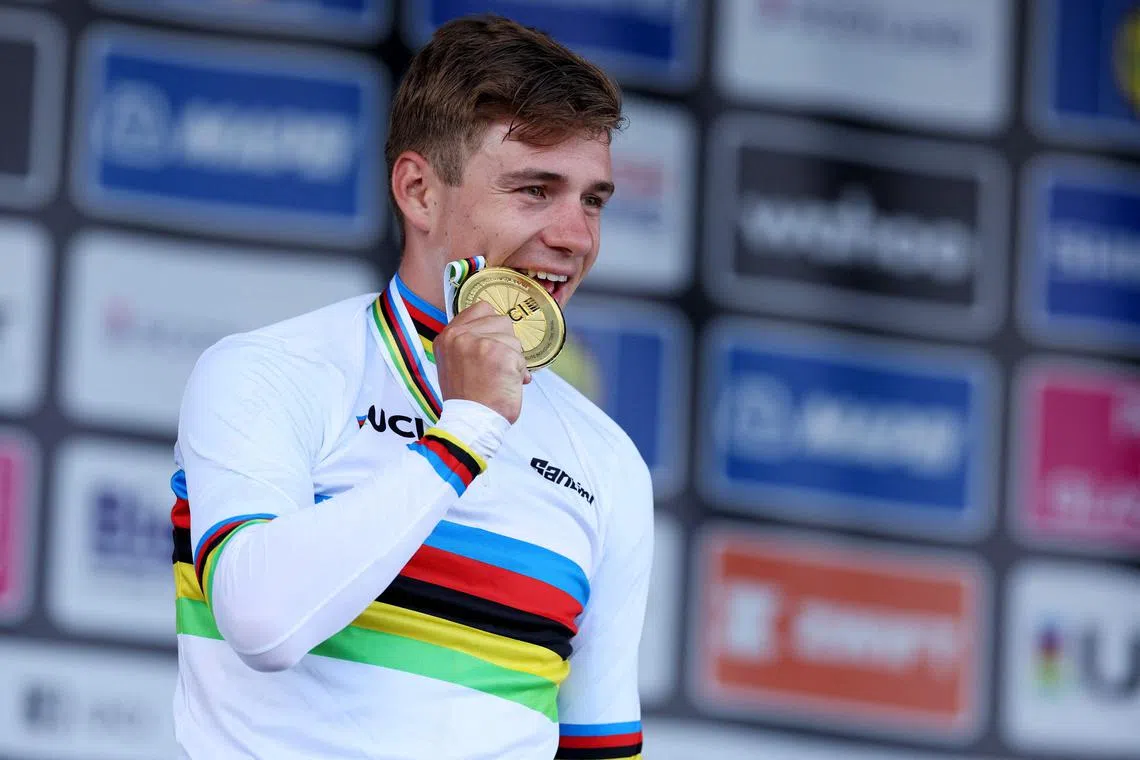 Belgium's Remco Evenepoel celebrates winning the men's individual time trial at the UCI Cycling World Championships in Scotland.