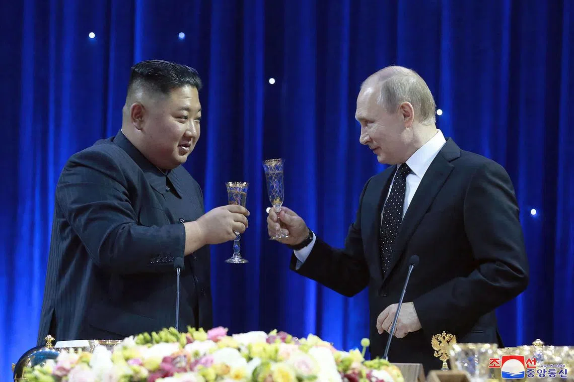Russian President Vladimir Putin (right) and North Korean leader Kim Jong Un attend a reception in Vladivostok, on April 25, 2019.