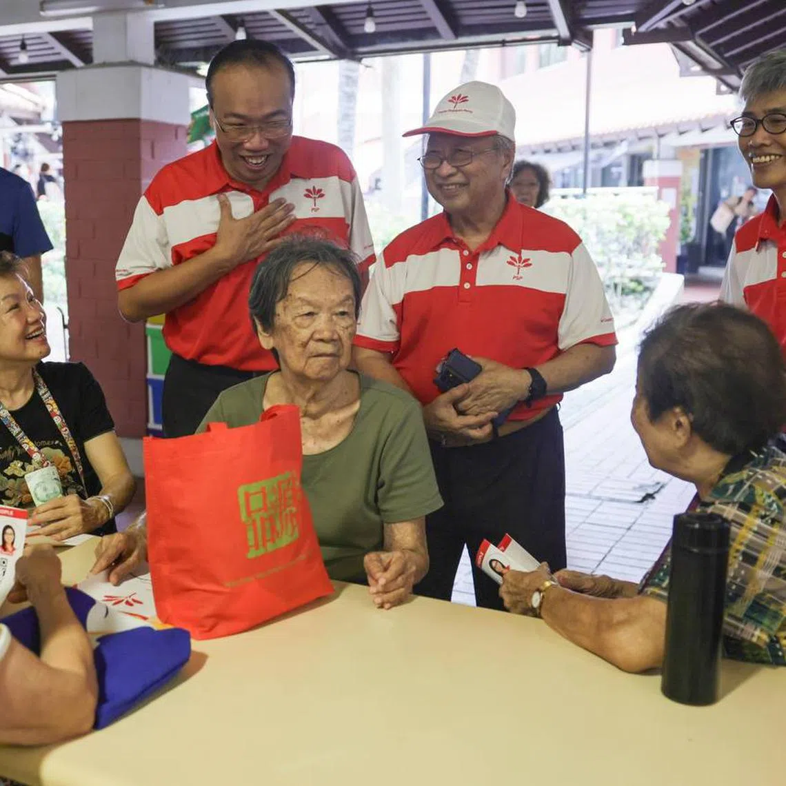PSP chairman Tan Cheng Bock (centre) with Mr Jeffrey Khoo (left) and Mr Tony Tan during a walkabout at Bishan Street 22 on April 17.