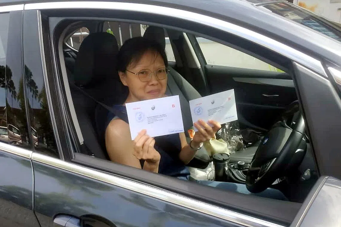 Housewife Joanna Tan Sue Mae, 53, driving back from Singapore to drop off her postal votes in Johor.