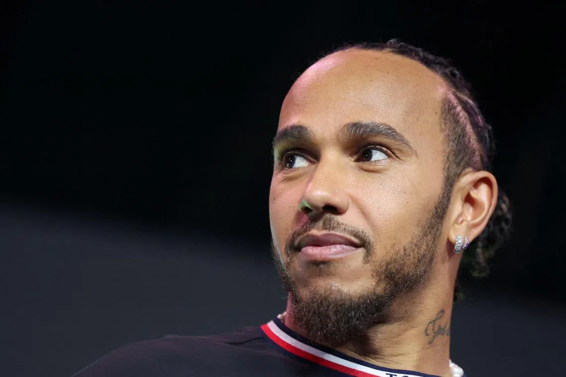FILE PHOTO: Formula One Mercedes-AMG Petronas F1 Team driver Lewis Hamilton reacts during a farewell event for his team in Kuala Lumpur, Malaysia December 10, 2024. REUTERS/Hasnoor Hussain/File Photo
