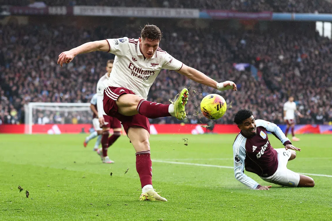 Soccer Football - Premier League - Aston Villa v Arsenal - Villa Park, Birmingham, Britain - December 6, 2025 Arsenal's Viktor Gyokeres in action with Aston Villa's Ian Maatsen REUTERS/David Klein