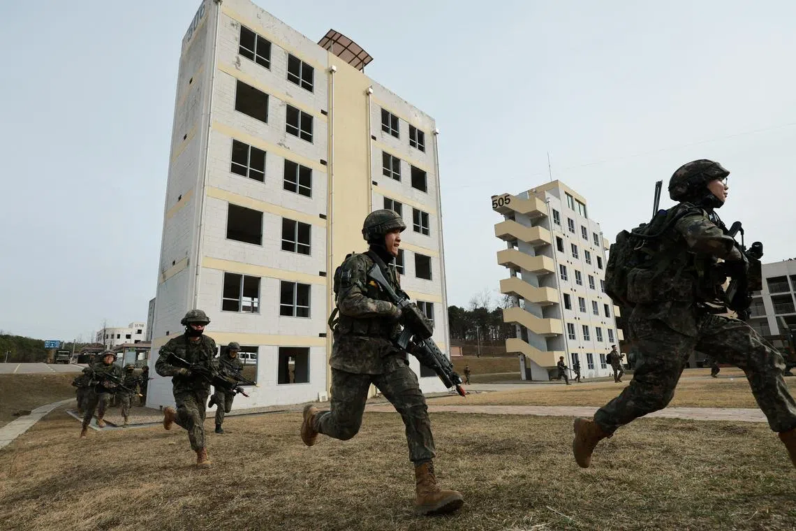 FILE PHOTO: South Korean soldiers take part in a joint military drill which is a part of the Freedom Shield joint military exercise between South Korea and U.S., at a military training field near the demilitarized zone separating the two Koreas in Paju, South Korea, March 16, 2023. Yonhap via REUTERS   ATTENTION EDITORS - THIS IMAGE HAS BEEN SUPPLIED BY A THIRD PARTY. SOUTH KOREA OUT. NO RESALES. NO ARCHIVE./File Photo