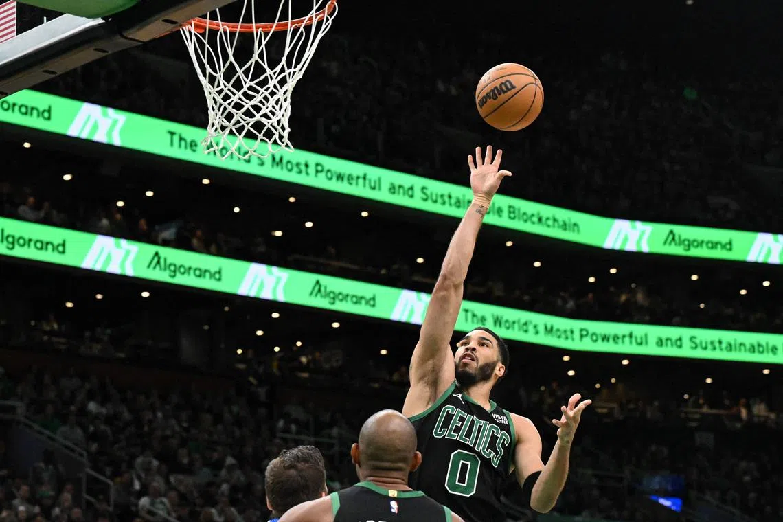 Jayson Tatum of the Boston Celtics attempts a basket against the Dallas Mavericks during the fourth quarter at the TD Garden.