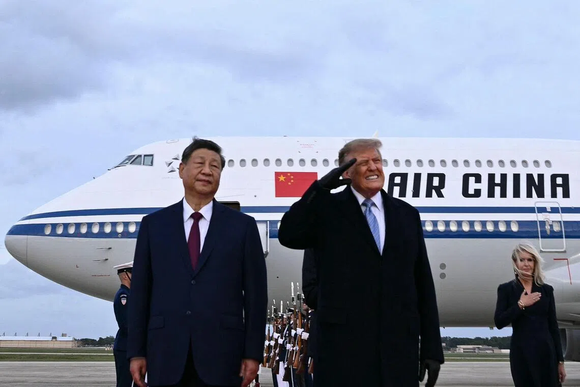 US President Donald Trump winced after a B-1 bomber flew past at Joint Base Andrews while Chinese President Xi Jinping watched impassively.