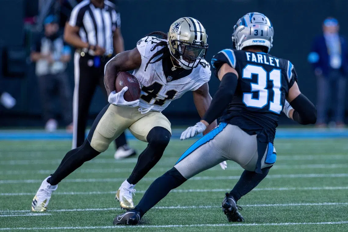 FILE PHOTO: Nov 3, 2024; Charlotte, North Carolina, USA; New Orleans Saints running back Alvin Kamara (41) runs the ball against Carolina Panthers cornerback Caleb Farley (31) during the fourth quarter at Bank of America Stadium. Mandatory Credit: Scott Kinser-Imagn Images/File Photo
