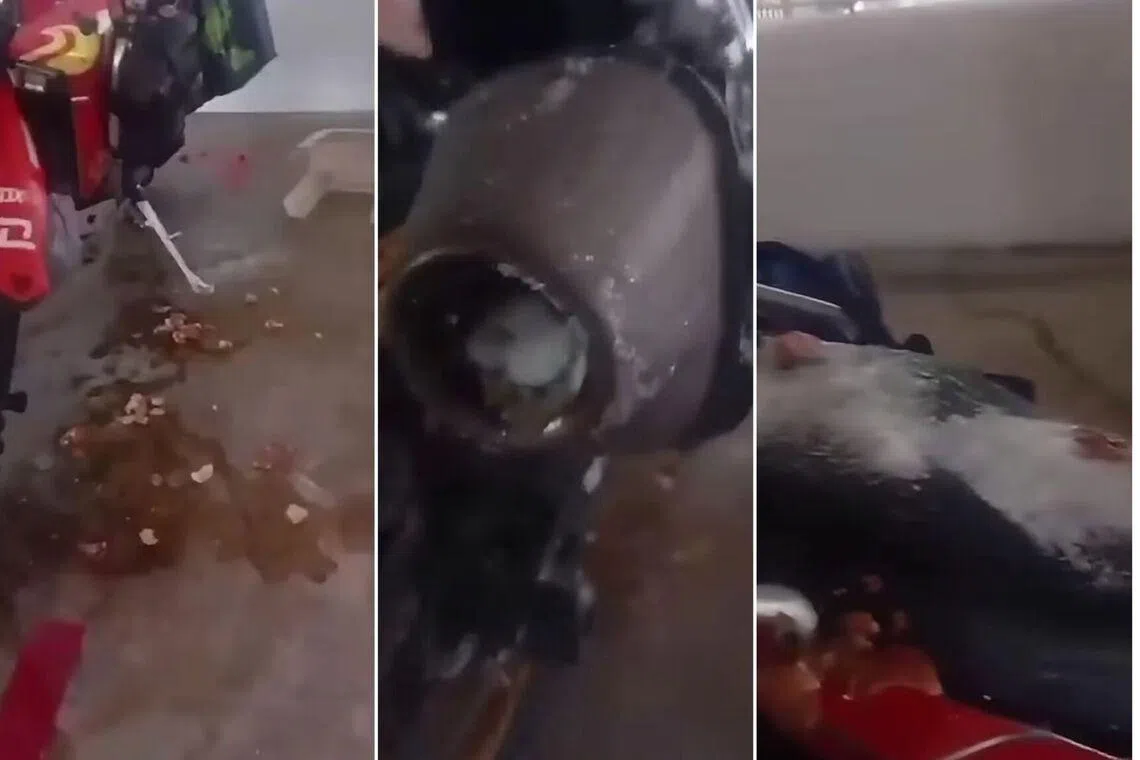 Aftermath of the motorcycle covered with what appears to be raw eggs.