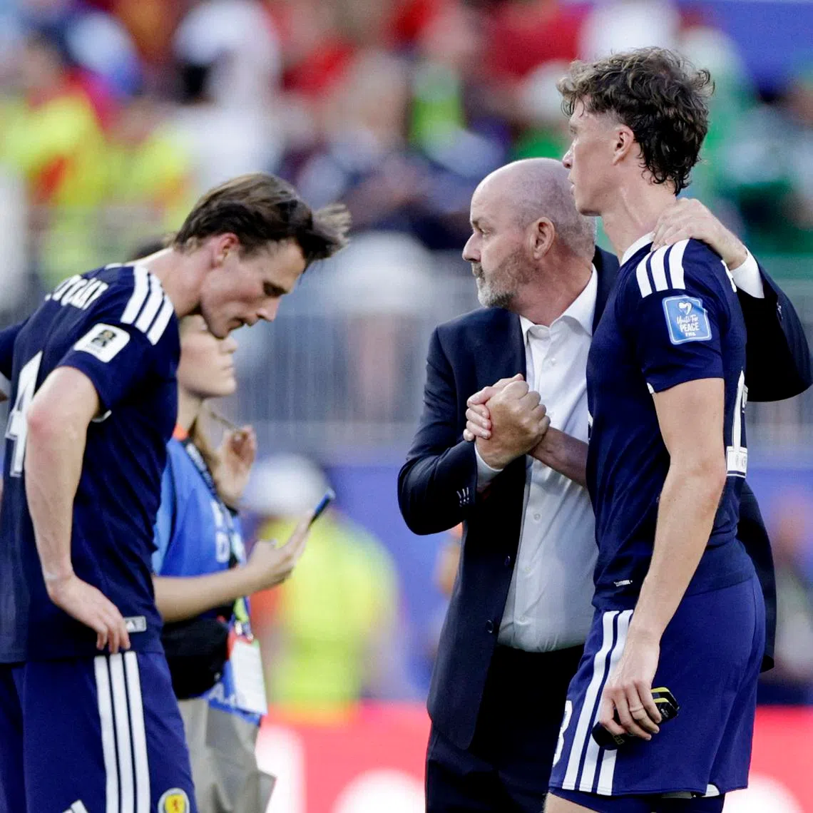 Soccer Football - FIFA World Cup 2026 - Group C - Scotland v Morocco - Boston Stadium, Foxborough, Massachusetts, U.S. - June 19, 2026 Scotland manager Steve Clarke, Jack Hendry and Scott McTominay look dejected after the match REUTERS/Pilar Olivares