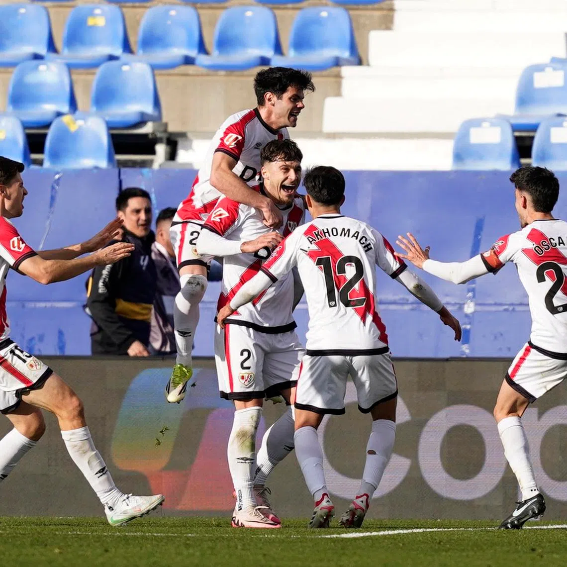 Soccer Football - LaLiga - Rayo Vallecano v Atletico Madrid - Estadio Municipal de Butarque, Leganes, Spain - February 15, 2026 Rayo Vallecano's Fran Perez celebrates scoring their first goal with teammates REUTERS/Ana Beltran