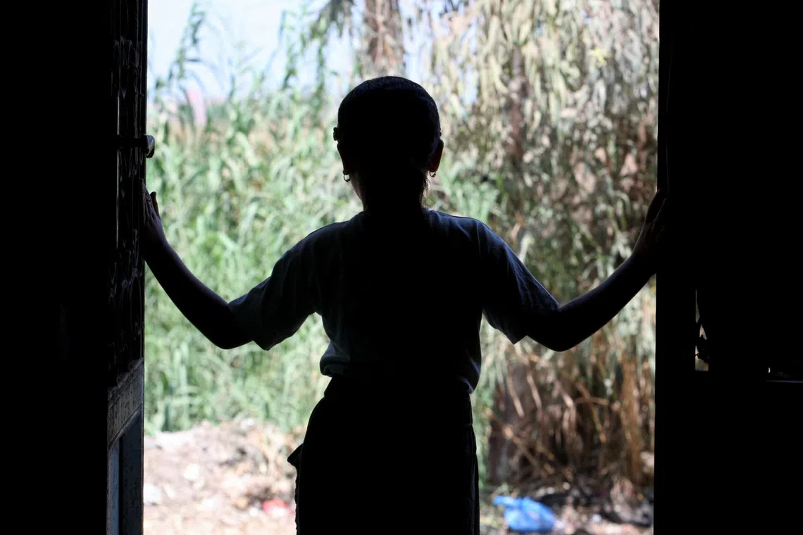 The daughter of Egyptian rape survivor Amal Abdel Hameed, who won a landmark paternity case, looks outside from her family home in Dakahlia Governorate, in the northeast of Egypt's Nile Delta, August 17, 2026. REUTERS/Stringer