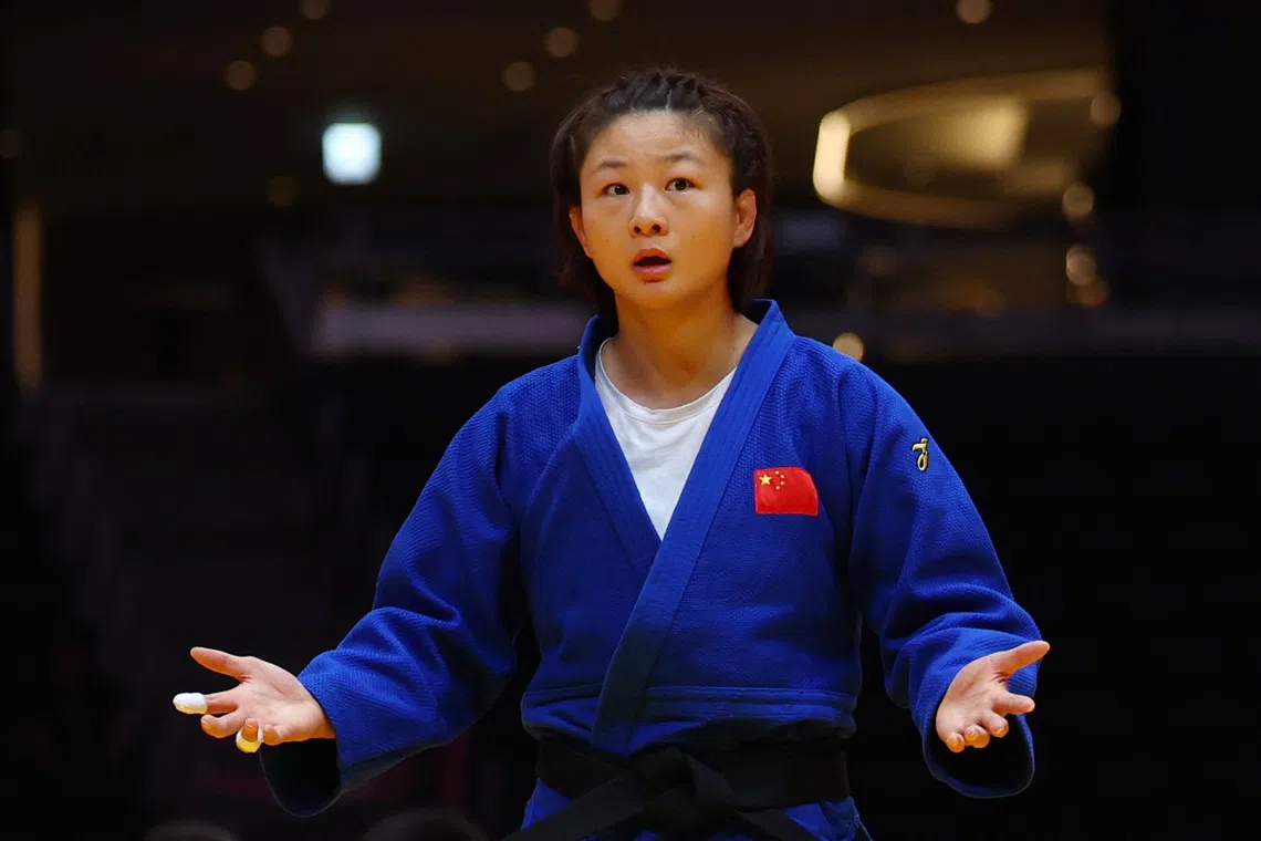 China’s Tang Jing was disqualified just over a minute into her quarter-final bout against Japan’s Rin Maeda.