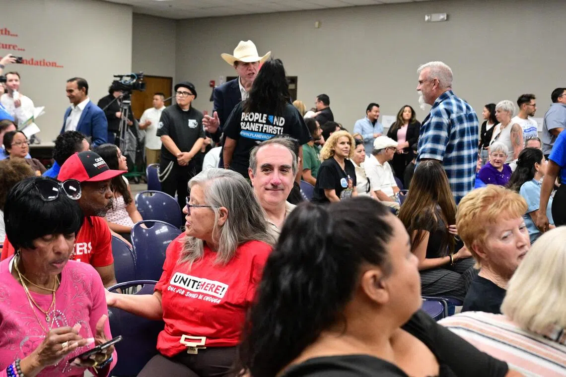 Aaron Mahan (centre), a worker on the Las Vegas strip, attends a town hall meeting in Las Vegas on Aug 19. Mahan considers himself a victim of the “Trump slump”.