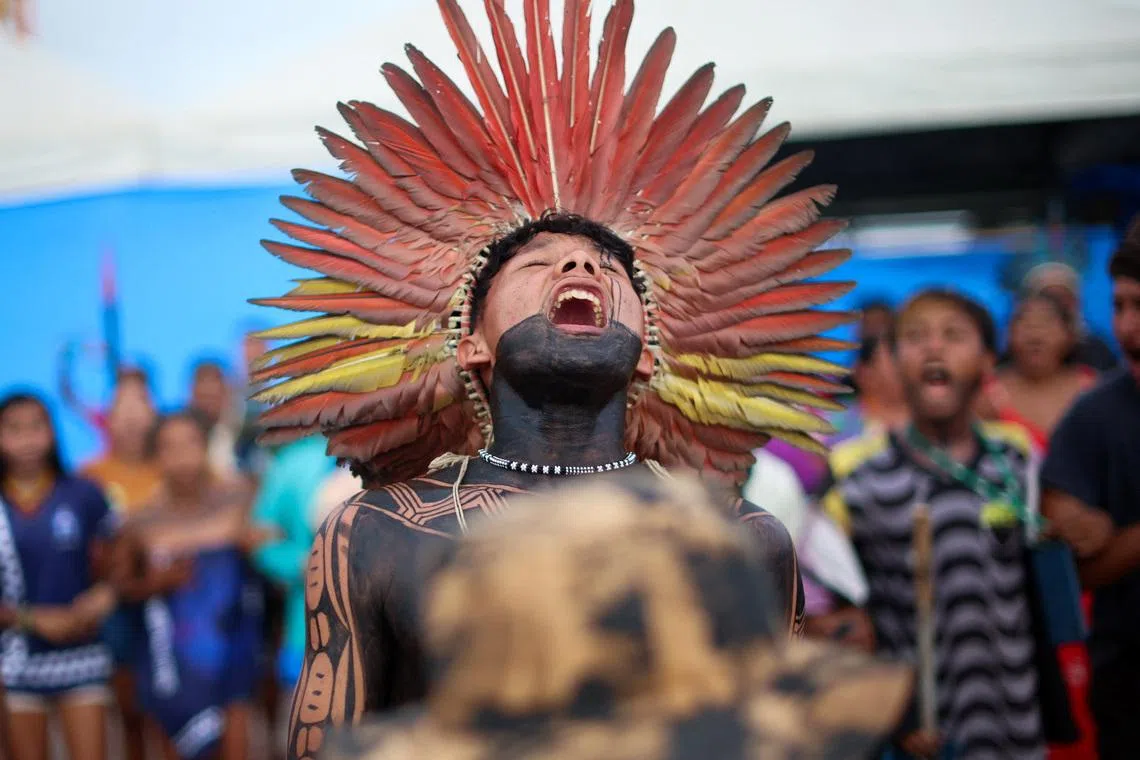Indigenous people celebrate after Brazilian President Luiz Inacio Lula da Silva’s government revoked Decree 12,600, which allowed plans to dredge the Tapajos River and expand rail transport of soy and corn for export markets, outside Cargill’s Santarem terminal in Santarem, Brazil February 23, 2026. REUTERS/Adriano Machado