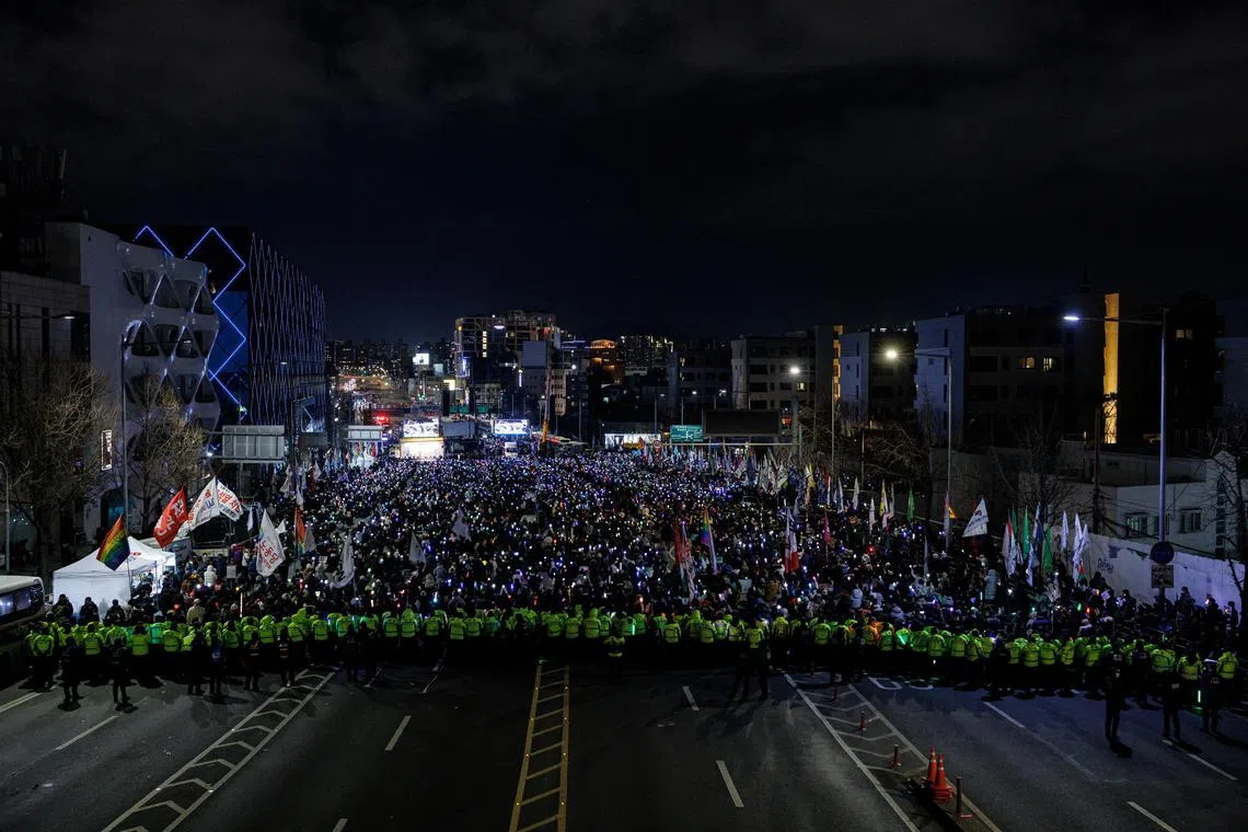People taking part in a protest against the impeached South Korean President Yoon Suk Yeol near his official residence in Seoul, South Korea, on Jan 4.