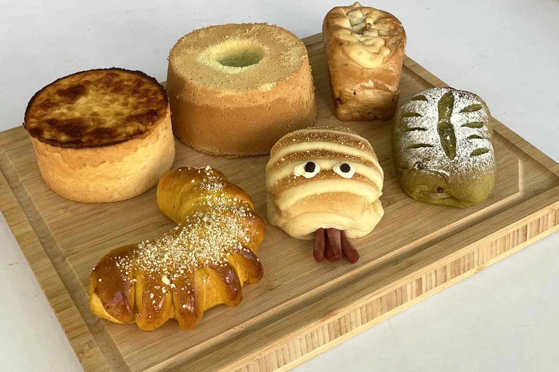 Clockwise from back row, far left: Honey Cheese Cake, Pandan Chiffon Cake, Multigrain Bun, Squid Bun and Goji Berry Bun.