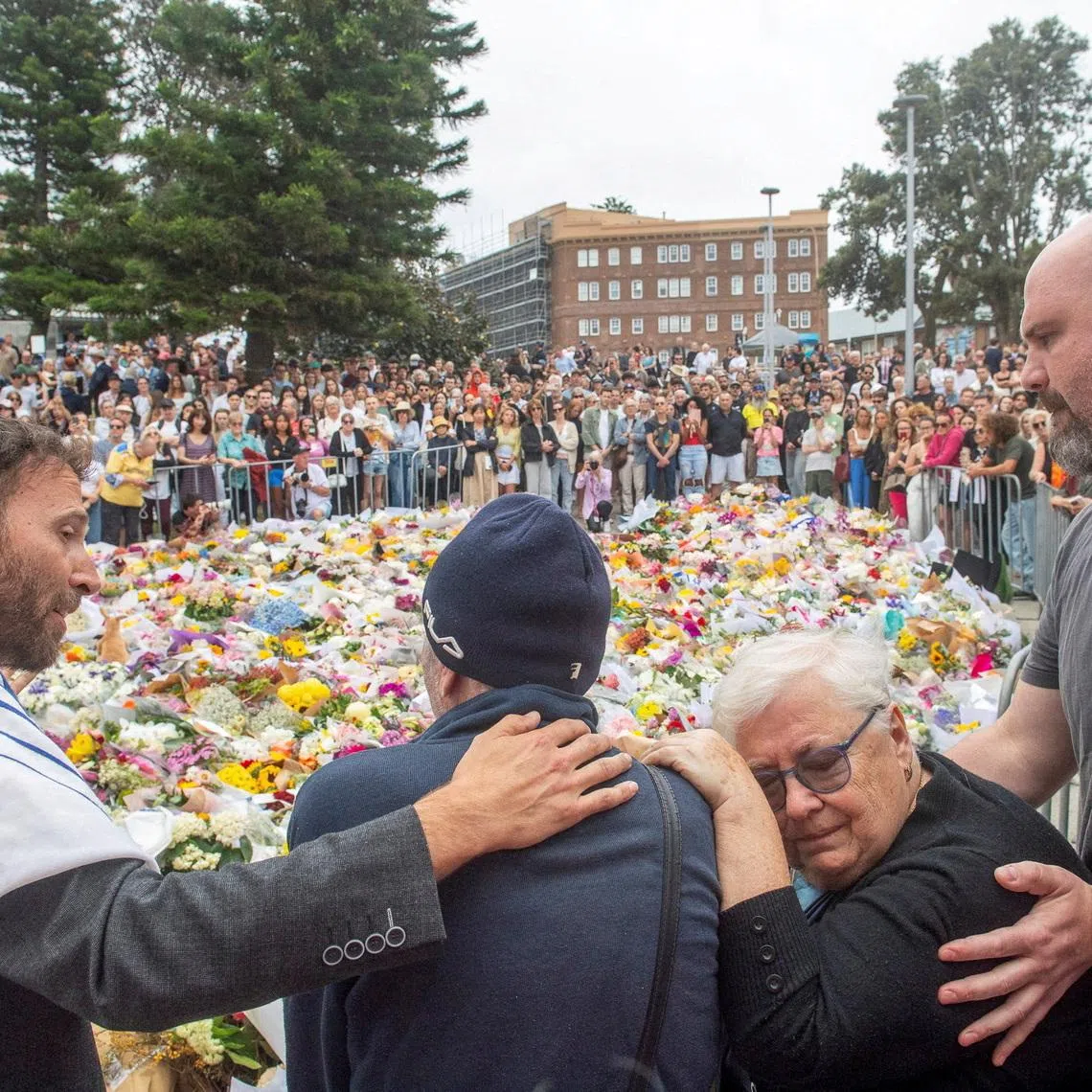 FILE PHOTO: Grandparents of 10-year-old Matilda, who was killed during a mass shooting targeting a Hanukkah celebration on Sunday, grieve at the floral memorial to honour the victims of the mass shooting at Bondi Beach, in Sydney, Australia, December 16, 2025. REUTERS/Jeremy Piper/File Photo
