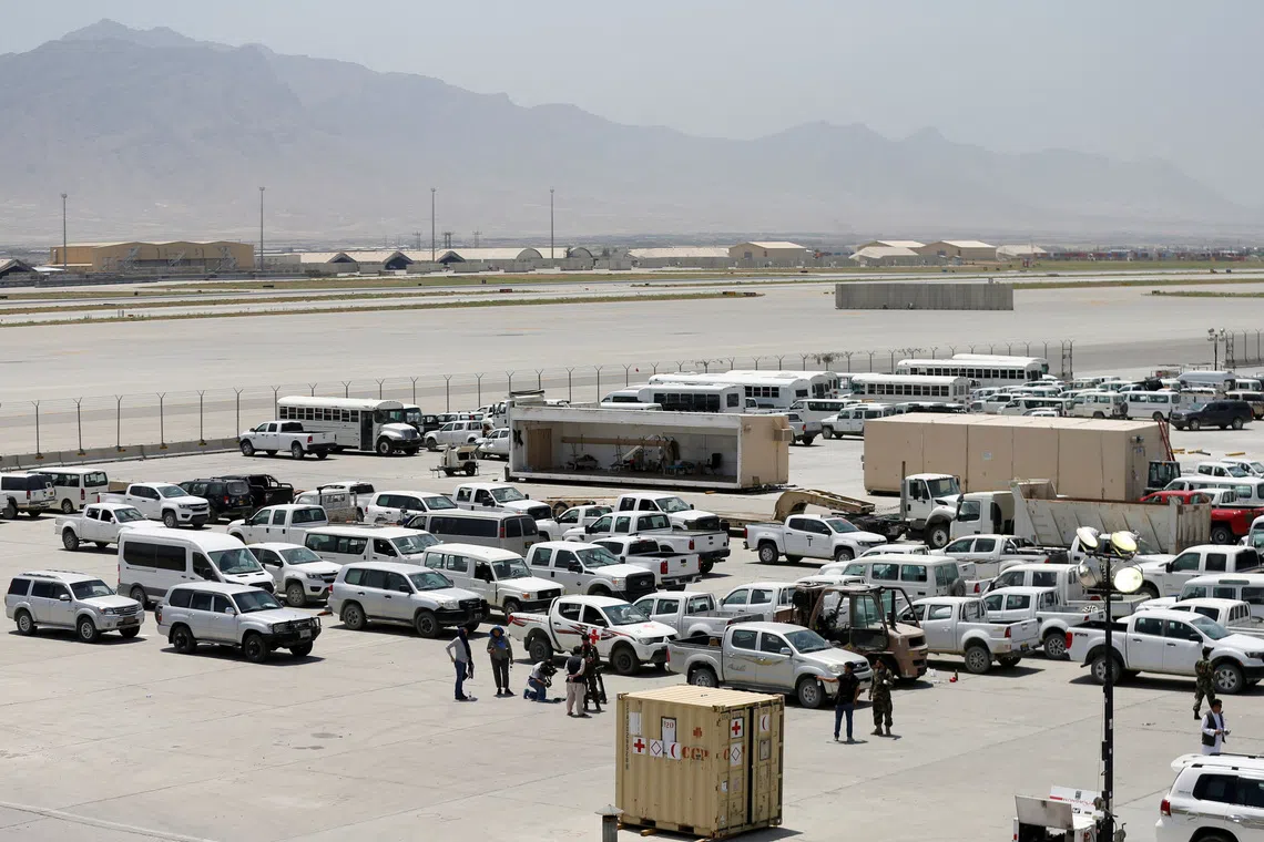 FILE PHOTO: Parked vehicles are seen in Bagram U.S. air base, after American troops vacated it, in Parwan province, Afghanistan July 5, 2021. REUTERS/Mohammad Ismail/File Photo