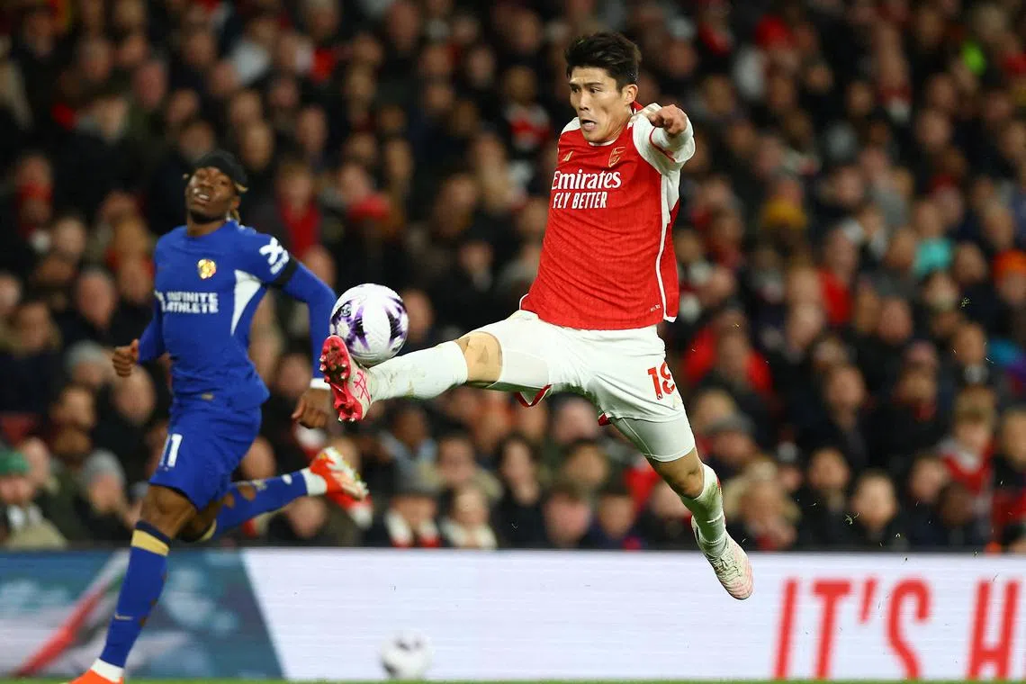FILE PHOTO: Soccer Football - Premier League - Arsenal v Chelsea - Emirates Stadium, London, Britain - April 23, 2024 Arsenal's Takehiro Tomiyasu in action Action Images via Reuters/Matthew Childs/File Photo