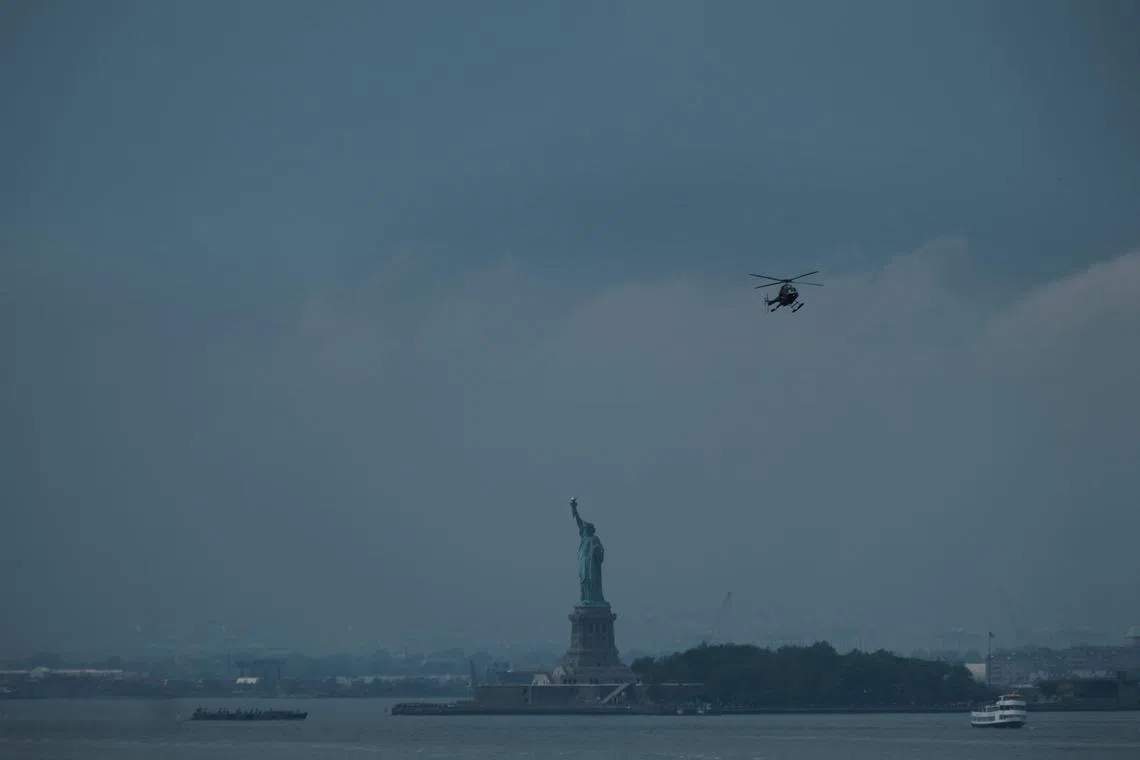 Clouds move in over the Statue of Liberty on June 26 in New York City. The city is bracing itself for severe thunderstorms on Sunday and Monday.  