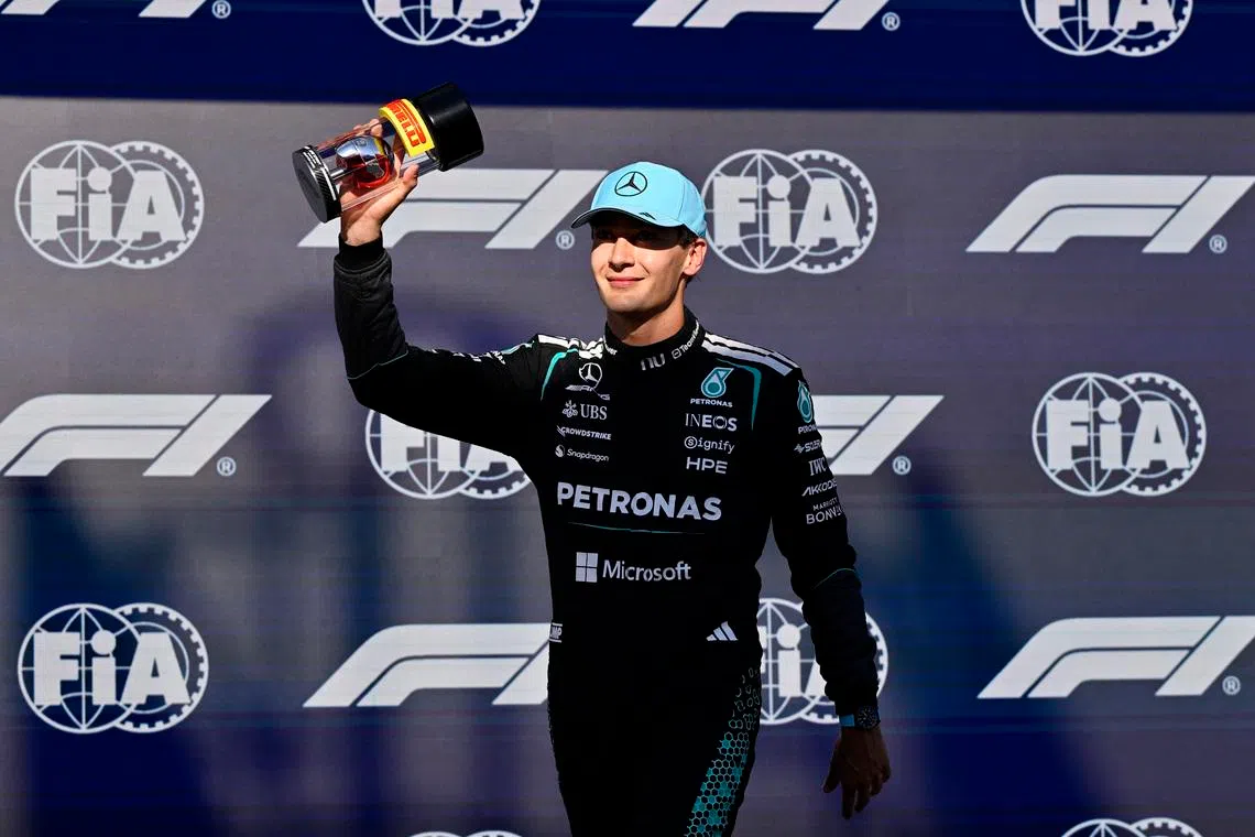 Formula One F1 - Canadian Grand Prix - Circuit Gilles Villeneuve, Montreal, Quebec, Canada - May 22, 2026 Mercedes' George Russell celebrates after qualifying in pole position for the sprint race REUTERS/Jennifer Gauthier