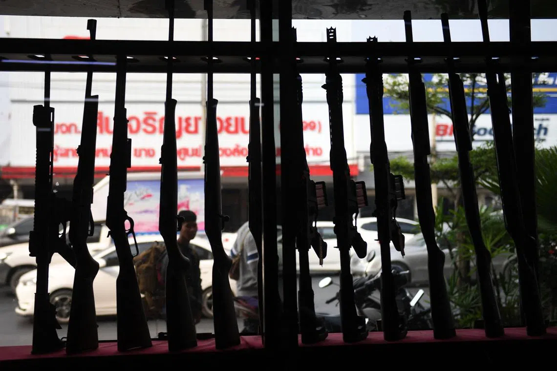 Guns set up in a window display at the Ratchasima Gun Shop in Nakhon Ratchasima in 2020.