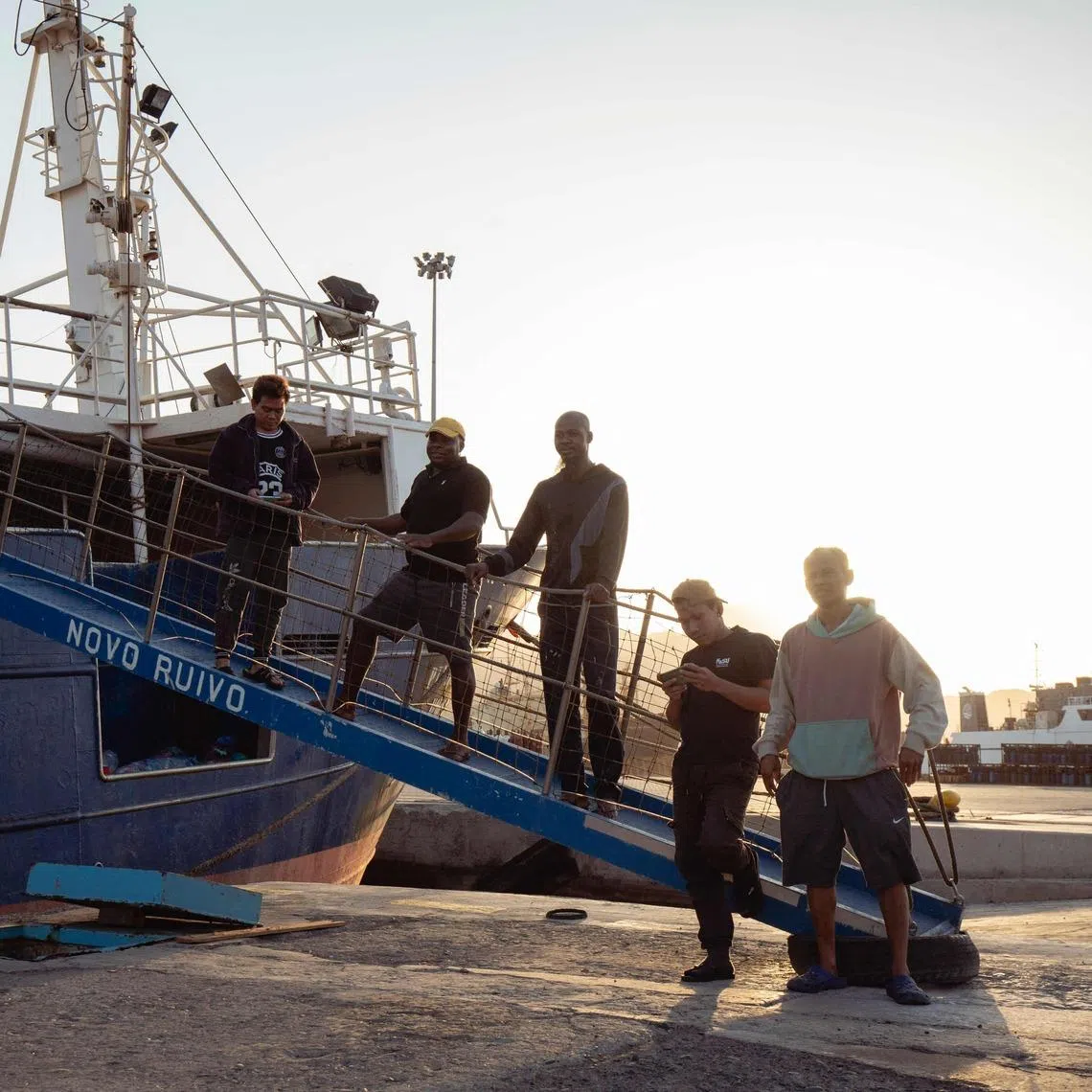 (from left) Crew members Wahyudin, Pedro, Jose Viti, Rizal Harun and Surono are stranded with tuna long liner fishing vessel Novo Ruivo who sails under a Portuguese flag.