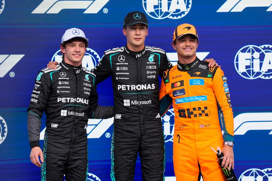 Formula One F1 - Canadian Grand Prix -  Circuit Gilles Villeneuve, Montreal, Quebec, Canada - May 23, 2026 Mercedes' George Russell celebrates after qualifying in pole position with second place Mercedes' Andrea Kimi Antonelli and third place McLaren's Lando Norris