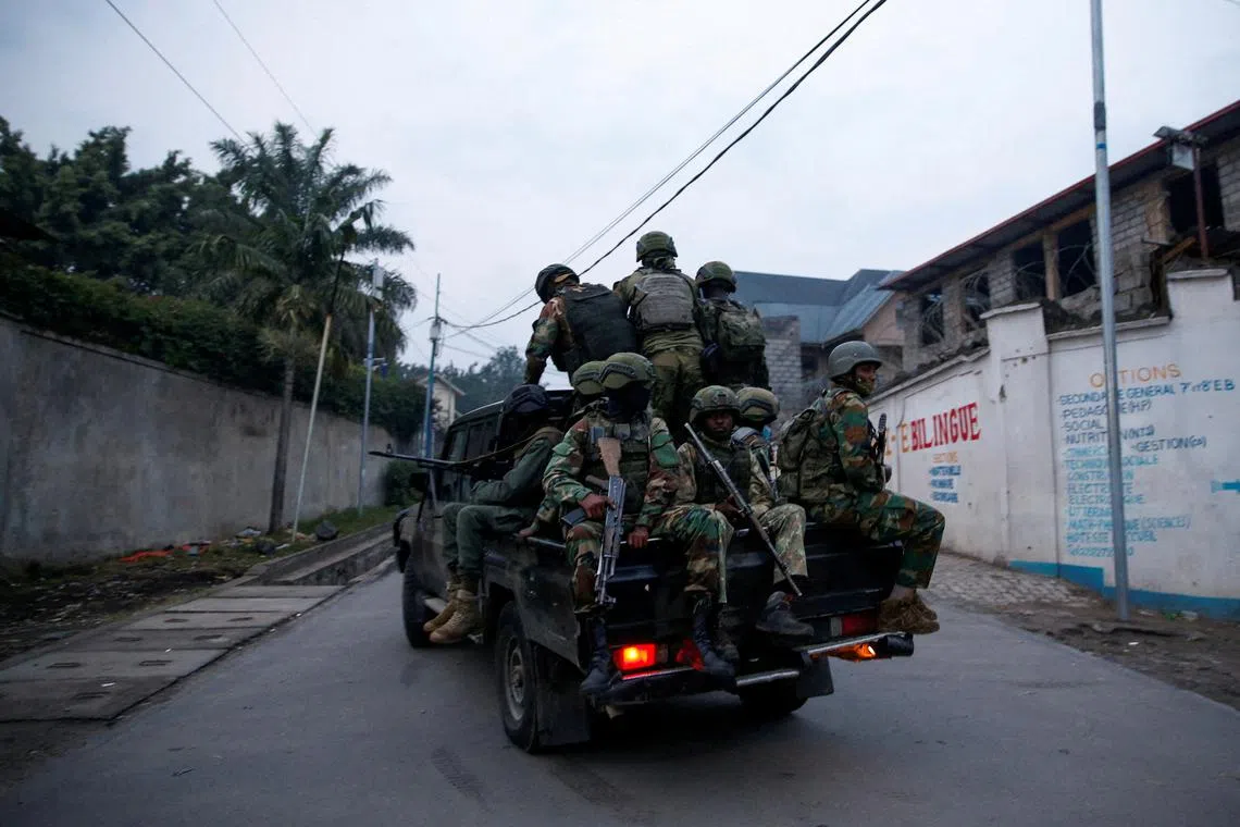 FILE PHOTO: Members of the M23 rebel group ride on a pickup truck as they leave their position for patrols amid conflict between them and the Armed Forces of the Democratic Republic of the Congo (FARDC), in Goma, eastern Democratic Republic of the Congo, January 29, 2025. REUTERS/Stringer//File Photo