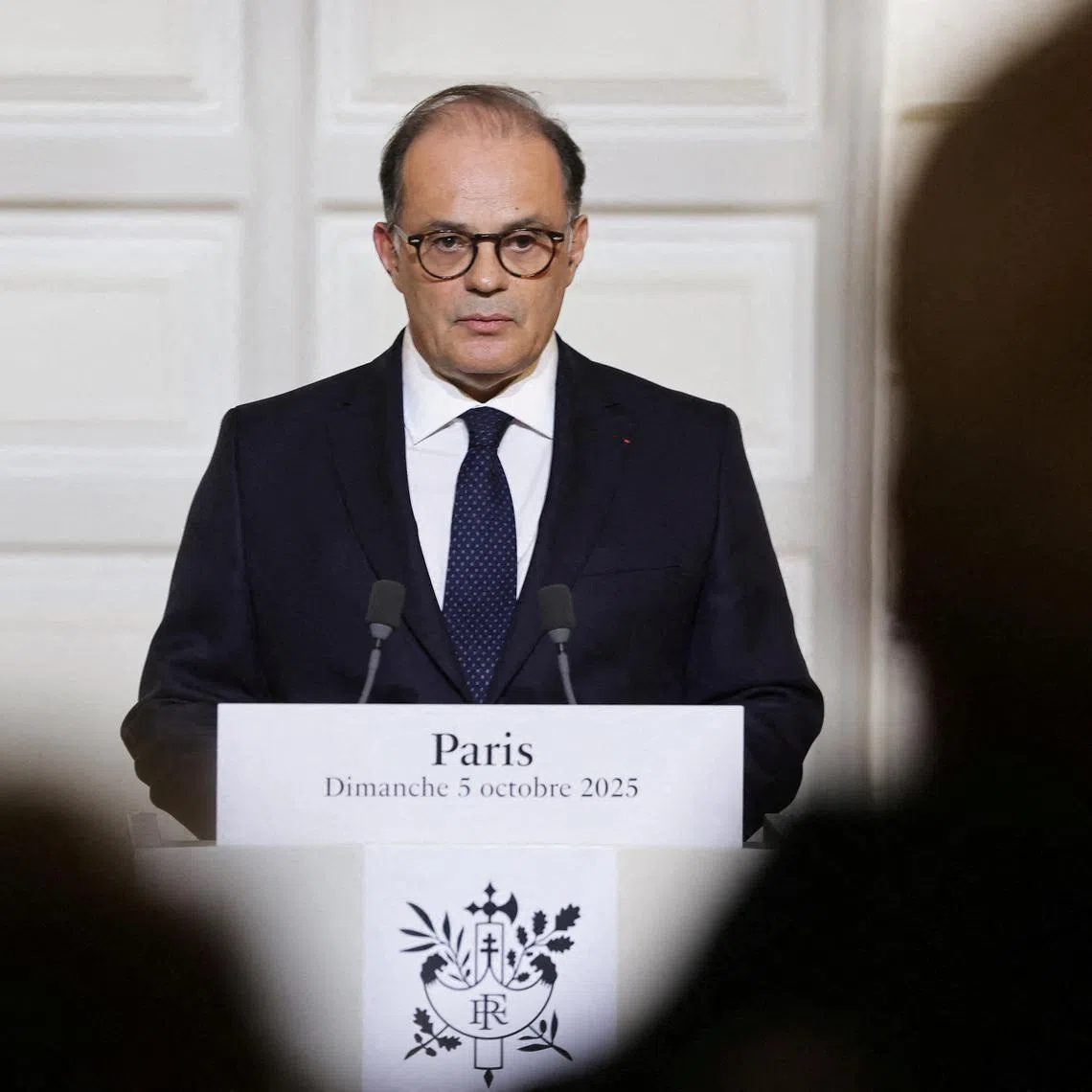 FILE PHOTO: French Secretary-General of the Elysee Palace, Emmanuel Moulin announces the first batch of names of the new ministers who make up the new cabinet, at the Elysee Palace, in Paris, France, 05 October 2025.   Christophe Petit Tesson/Pool via REUTERS/File Photo