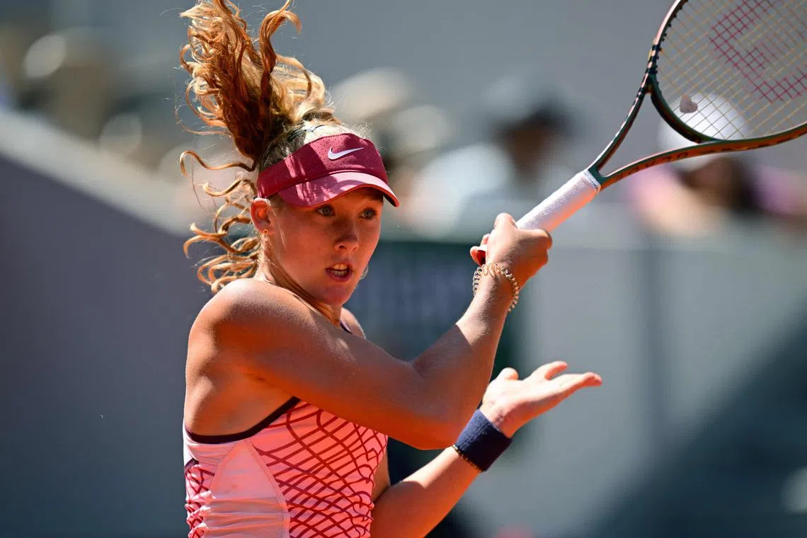 Mirra Andreeva plays a forehand return to the Coco Gauff, of the US.