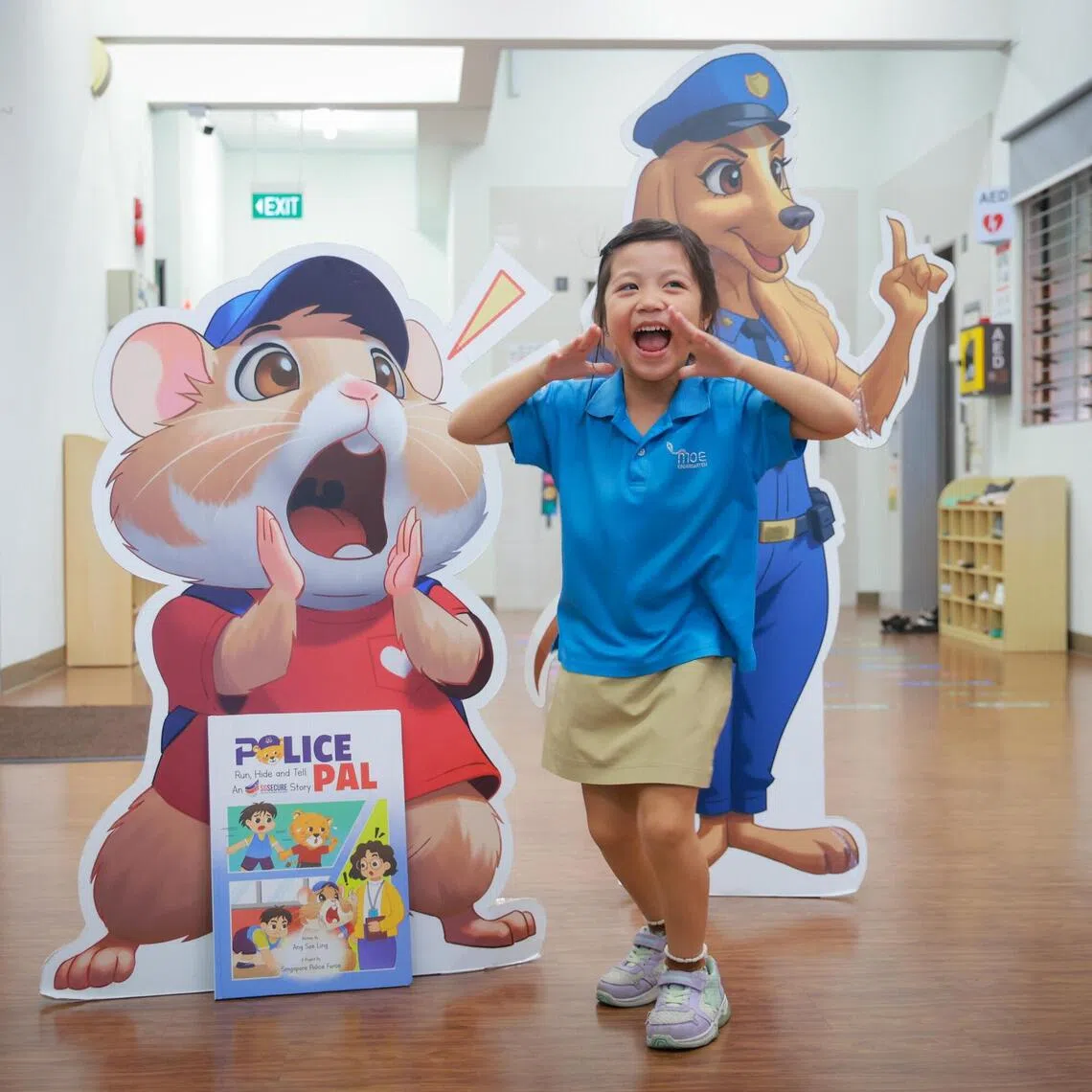 Juel Lee, six, imitating the character Hammie from the SGSecure edition of the Police Pal book series for pre-schoolers, titled Run, Hide And Tell: An SGSecure Story (bottom left), at MOE Kindergarten at West Spring on Oct 5.