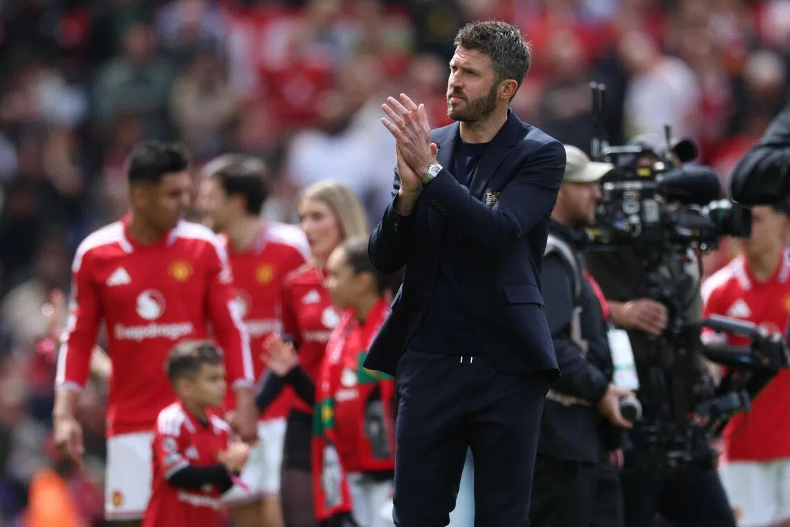 Manchester United manager Michael Carrick applauds fans after the Premier League match against Nottingham Forest.