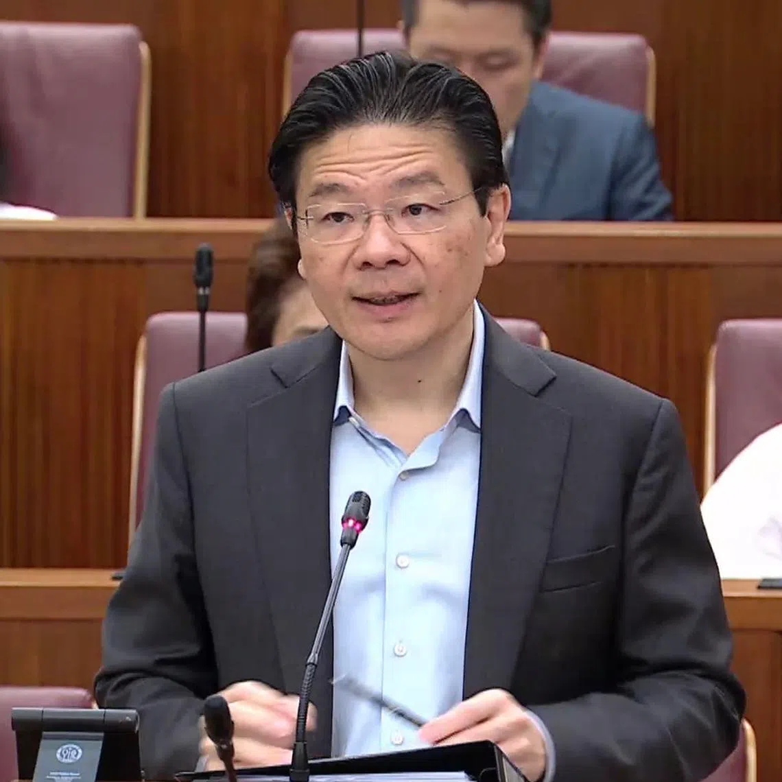 Prime Minister Lawrence Wong speaking in Parliament on Feb 26.
