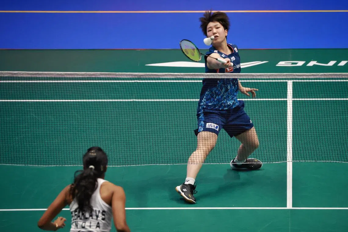 Akane Yamaguchi of Japan in action against Pusarla V. Sindhu of India during women singles round 1 of Singapore Badminton Open at Singapore Indoor Stadium on June 6, 2023. ST PHOTO: KEVIN LIM dlbad06