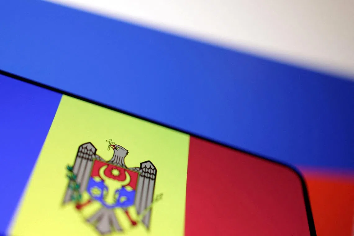 FILE PHOTO: Moldova and Russian flags are seen in this illustration taken December 28, 2024. REUTERS/Dado Ruvic/Illustration/File Photo
