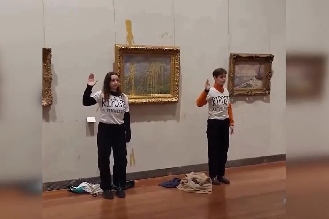 An image grab shows Claude Monet’s “Le Printemps” (Spring) after two activists threw soup at the glass-covered artwork.