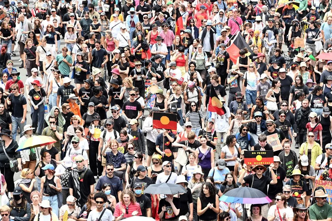 People take part in the Invasion Day protest march through Sydney during Australia Day 2026 celebrations, Australia, January 26, 2026. REUTERS/Jeremy Piper