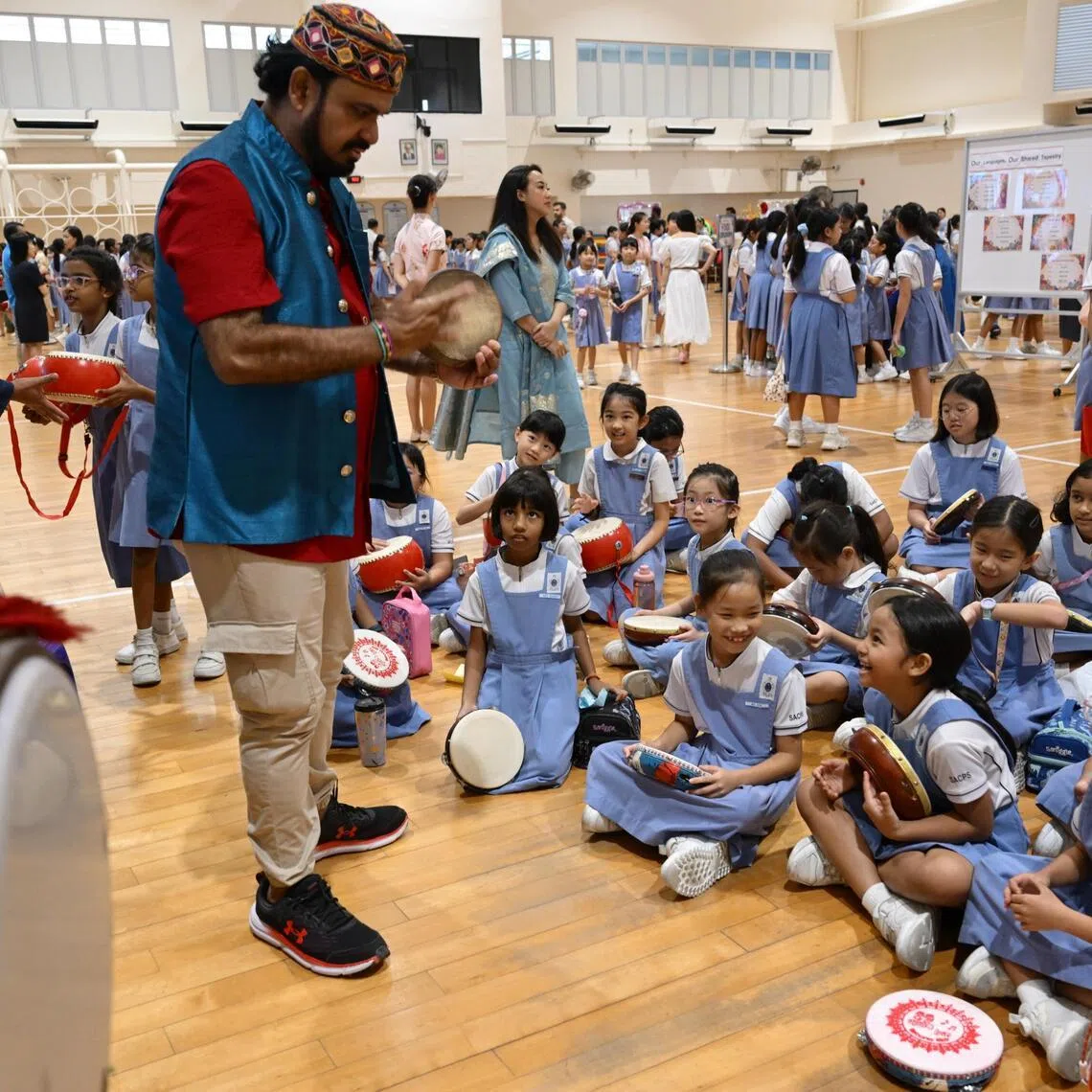Students from St Anthony’s Canossian Primary School play traditional Malay hand held drums, or kompang, as part of their Racial Harmony Day celebrations on July 21.